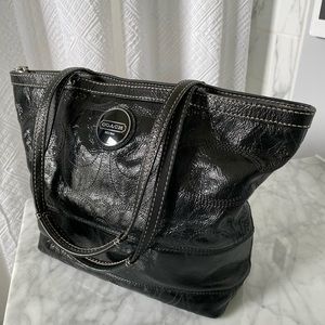 Black patent leather Coach handbag.